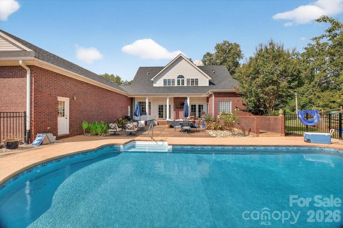 498 Johnson Dairy Road Mooresville, NC 28115 - Photo 35 of 43 a view of a house with swimming pool and sitting area