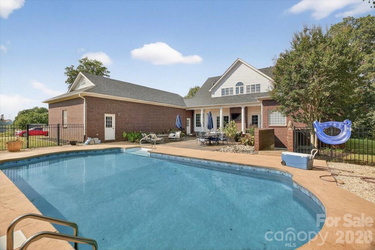 498 Johnson Dairy Road Mooresville, NC 28115 - Photo 37 of 43 a view of a house with swimming pool and sitting area
