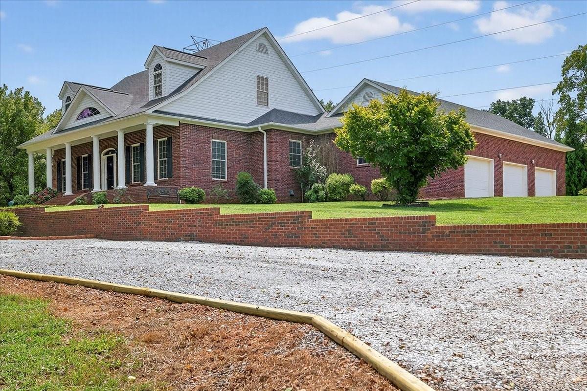 498 Johnson Dairy Road Mooresville, NC 28115 - Photo 42 of 43 a front view of a house with a yard and trees