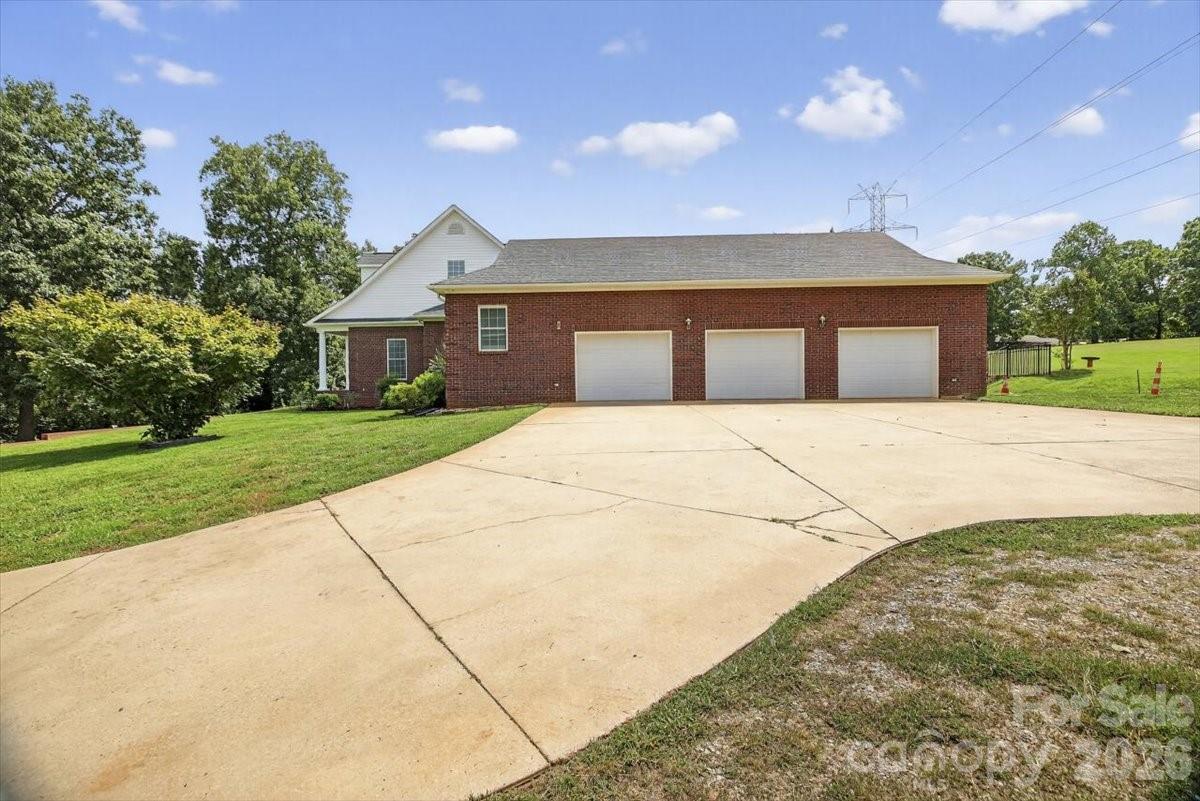 498 Johnson Dairy Road Mooresville, NC 28115 - Photo 43 of 43 a front view of a house with yard