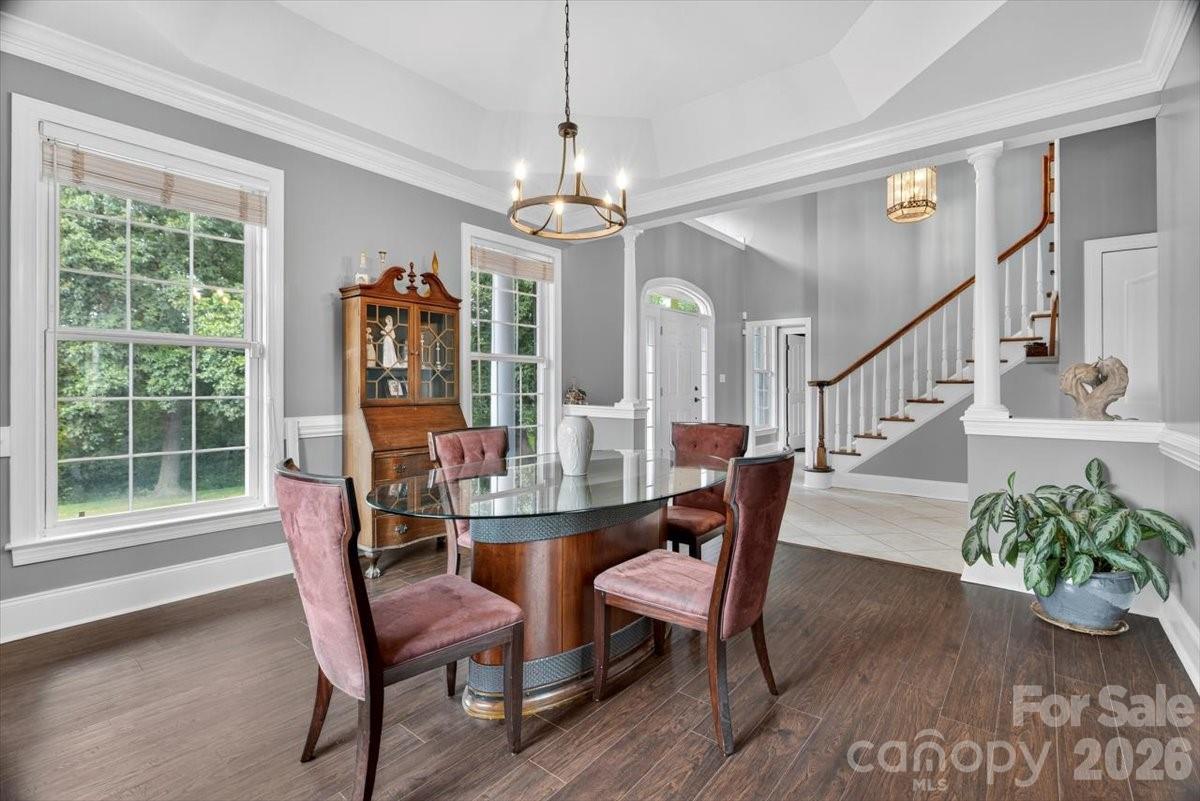 498 Johnson Dairy Road Mooresville, NC 28115 - Photo 9 of 43 a dining room with furniture a livingroom and chandelier