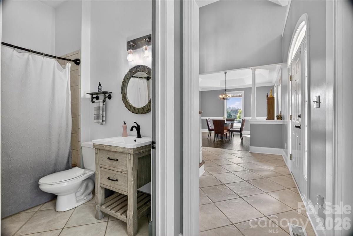 498 Johnson Dairy Road Mooresville, NC 28115 - Photo 10 of 43 a view of a bathroom with sink mirror and toilet
