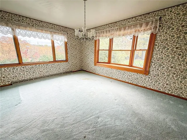 a view of a room with window chandelier and windows