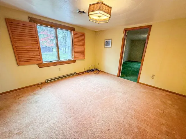a view of empty room with a sink