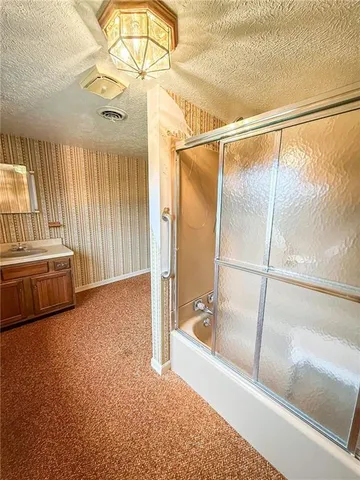 a view of a porch with a table and chairs