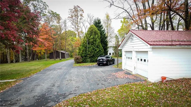 a view of a house with a backyard
