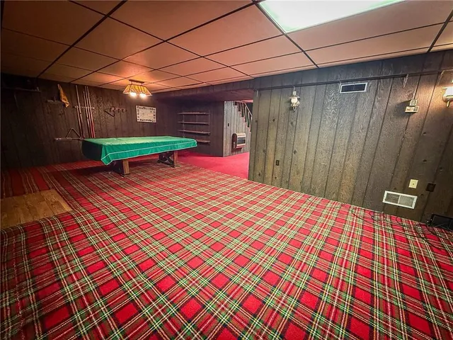 a view of a backyard with brick wall and roof