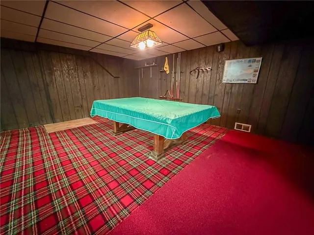 a view of a house with a yard and sitting area