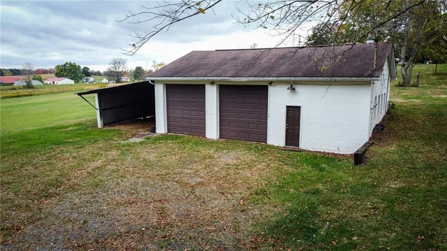 a backyard of a house with lots of green space