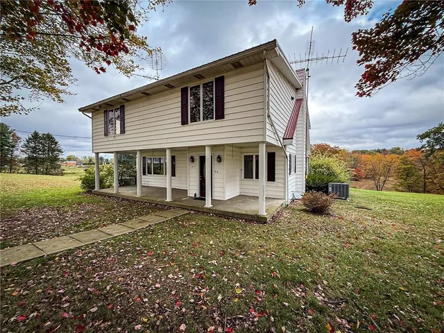 a view of a field with an trees
