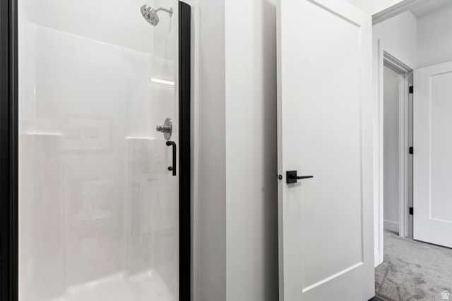 32 West 400 South Bountiful, UT 84010 - Photo 22 of 31 Bathroom with a stall shower and carpet
