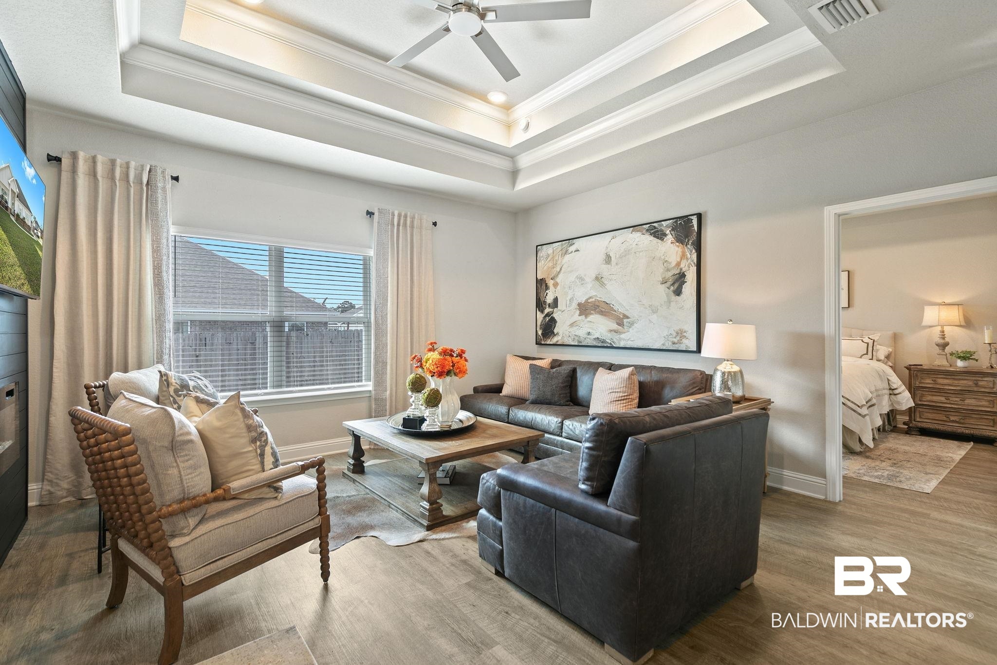 31650 Memphis Loop Daphne, AL 36527 - Photo 18 of 68 Living area featuring crown molding, wood finished floors, and a ceiling fan