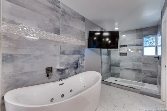 a bathroom with a bathtub and a toilet