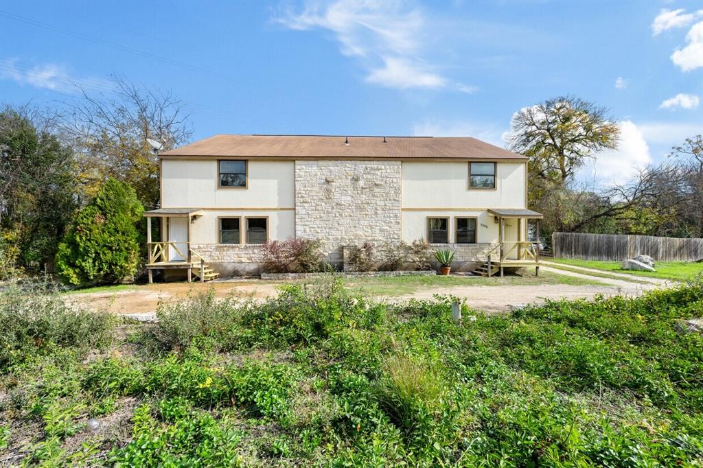 5205 Hudson Bend Road Austin, TX 78734 - Photo 1 of 21 a front view of house with yard and green space