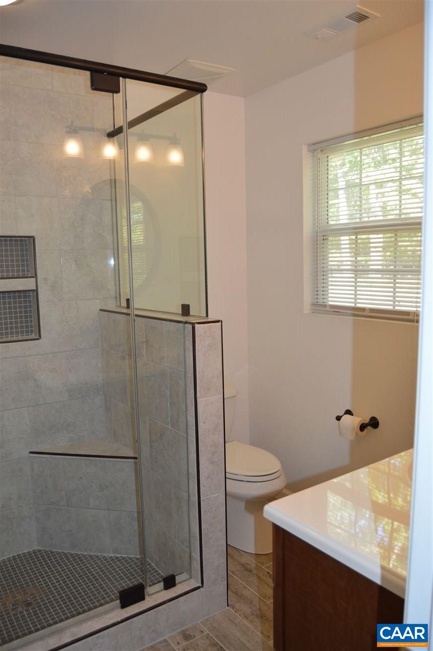 1771 Courthouse Road Palmyra, VA 22963 - Photo 23 of 27 a bathroom with a shower toilet and sink
