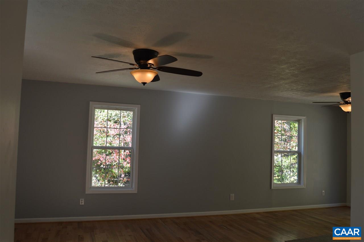 1771 Courthouse Road Palmyra, VA 22963 - Photo 8 of 27 an empty room with windows and fan