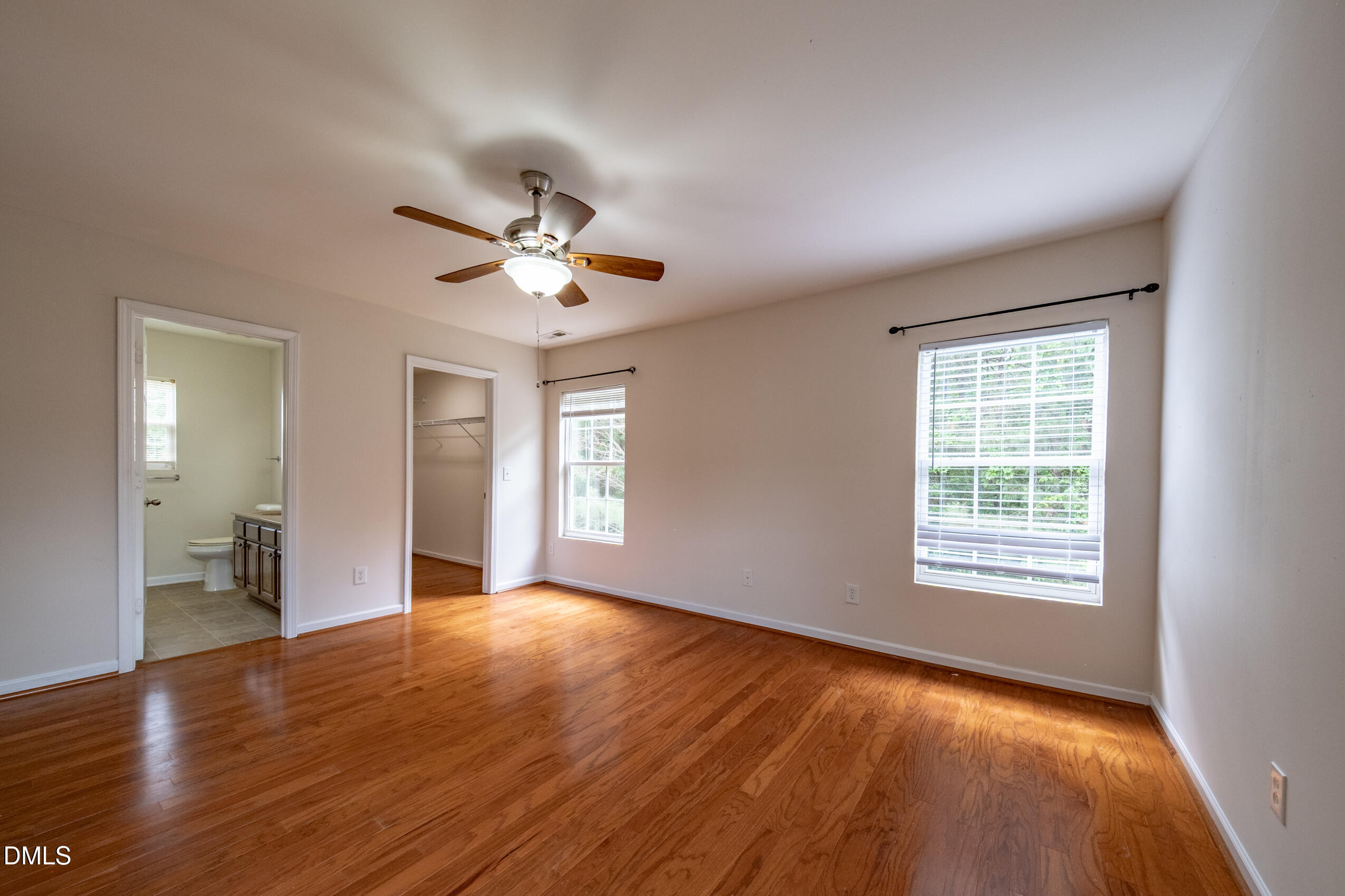 719 Obsidian Way Durham, NC 27703 - Photo 32 of 41 a view of an empty room with window and wooden floor