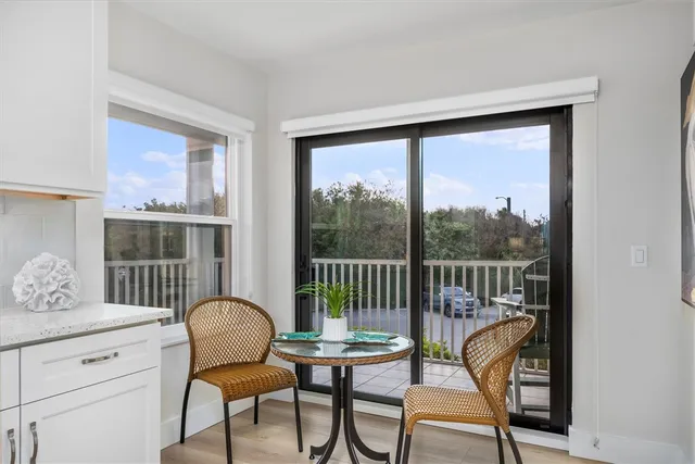 a view of a workspace room with furniture window and wooden floor