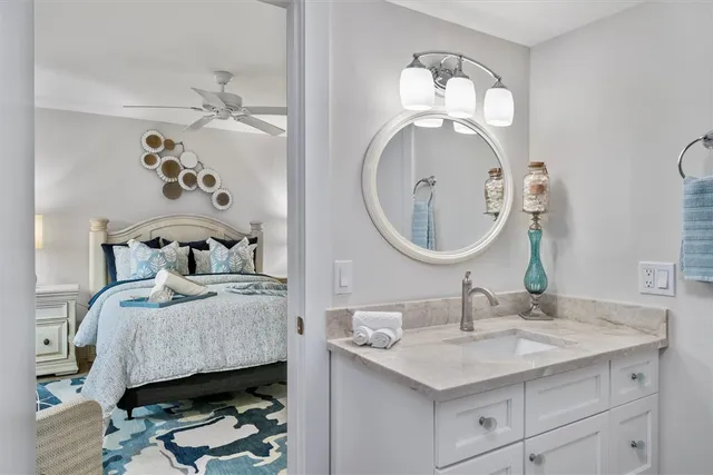 a en suite bathroom with a sink and a mirror