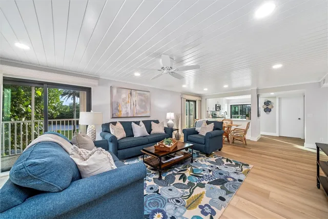 a living room with furniture or couch and a large window