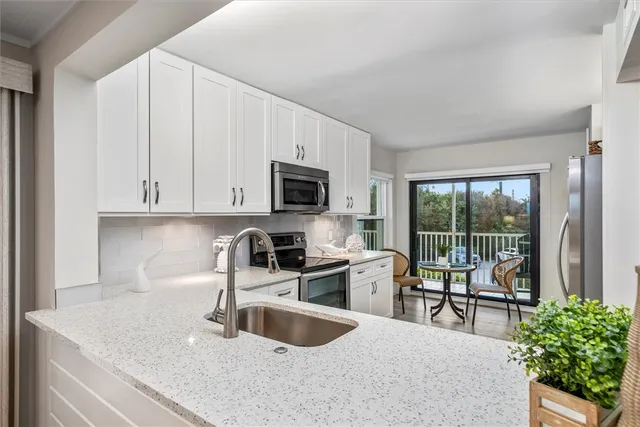 a kitchen with a sink and a microwave