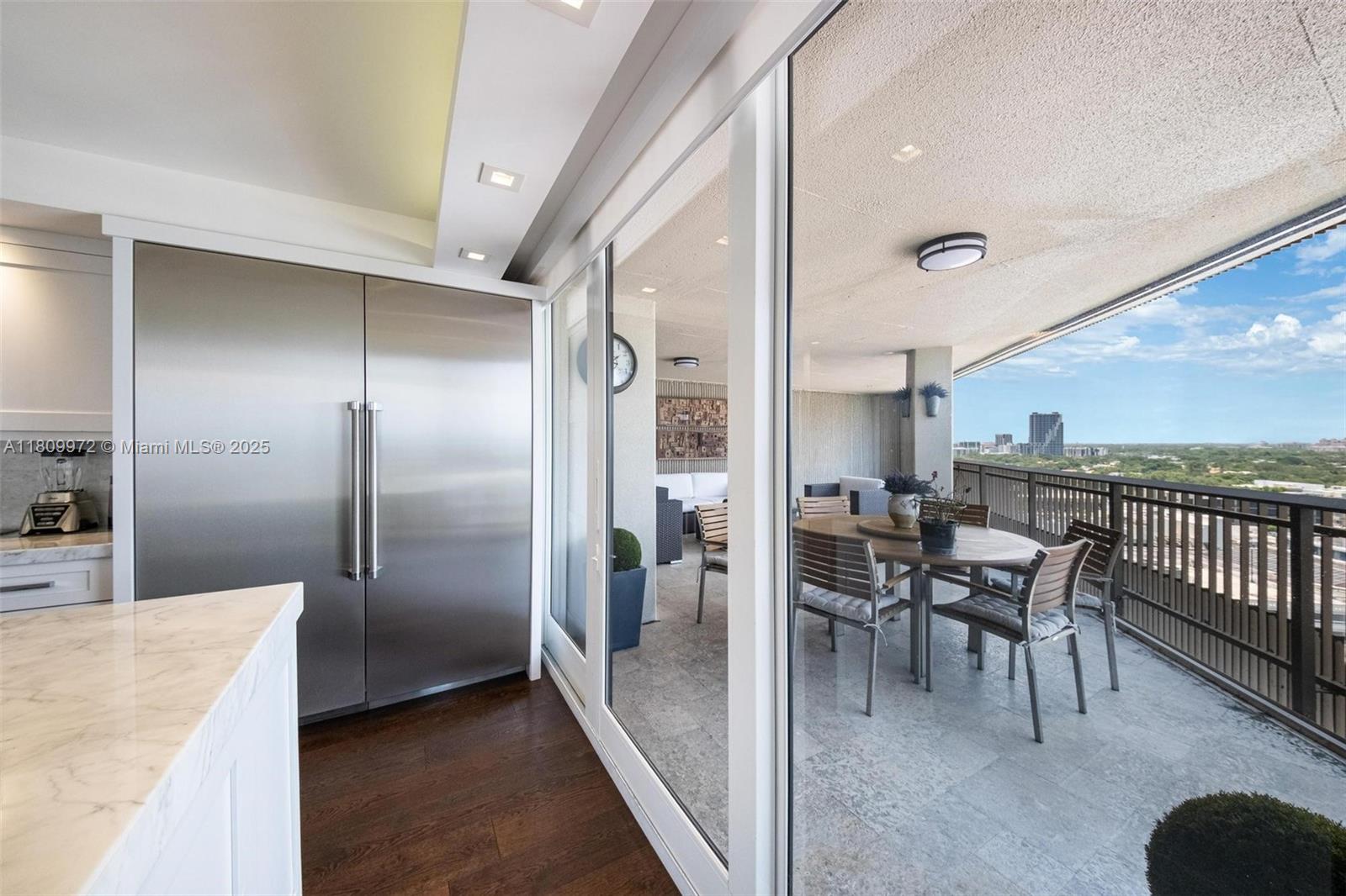 2901 South Bayshore Drive, Unit 17G/H Miami, FL 33133 - Photo 14 of 81 a dining room with furniture and a kitchen view