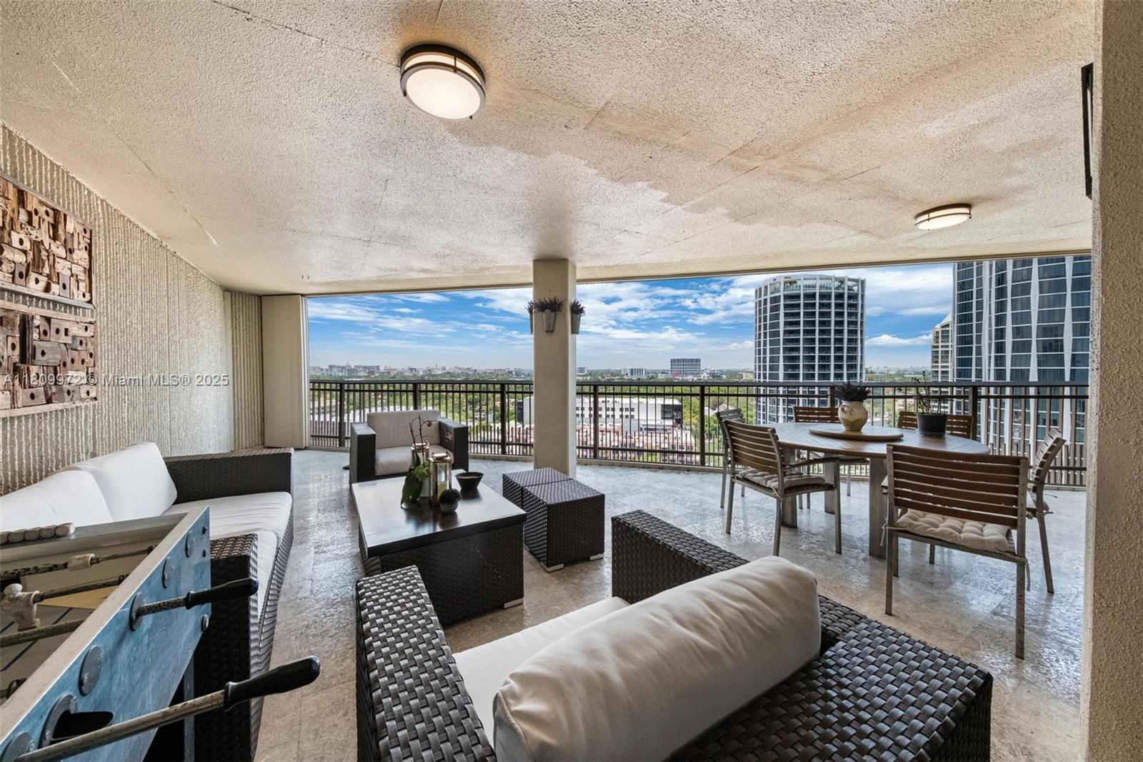 2901 South Bayshore Drive, Unit 17G/H Miami, FL 33133 - Photo 22 of 81 a living room with furniture a rug and a large window