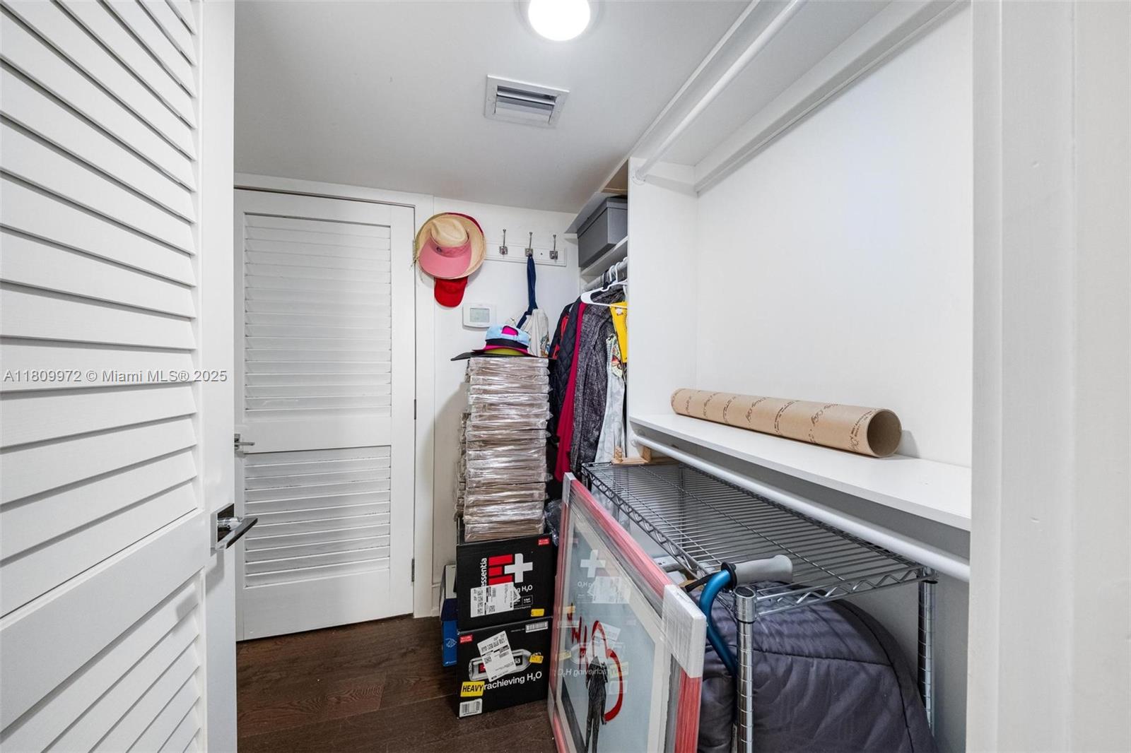2901 South Bayshore Drive, Unit 17G/H Miami, FL 33133 - Photo 30 of 81 a view of walk in closet with clothes and shoes
