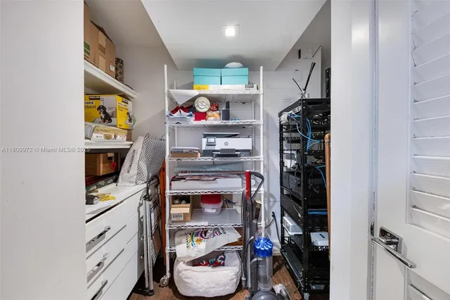 a white toilet sitting next to a shower