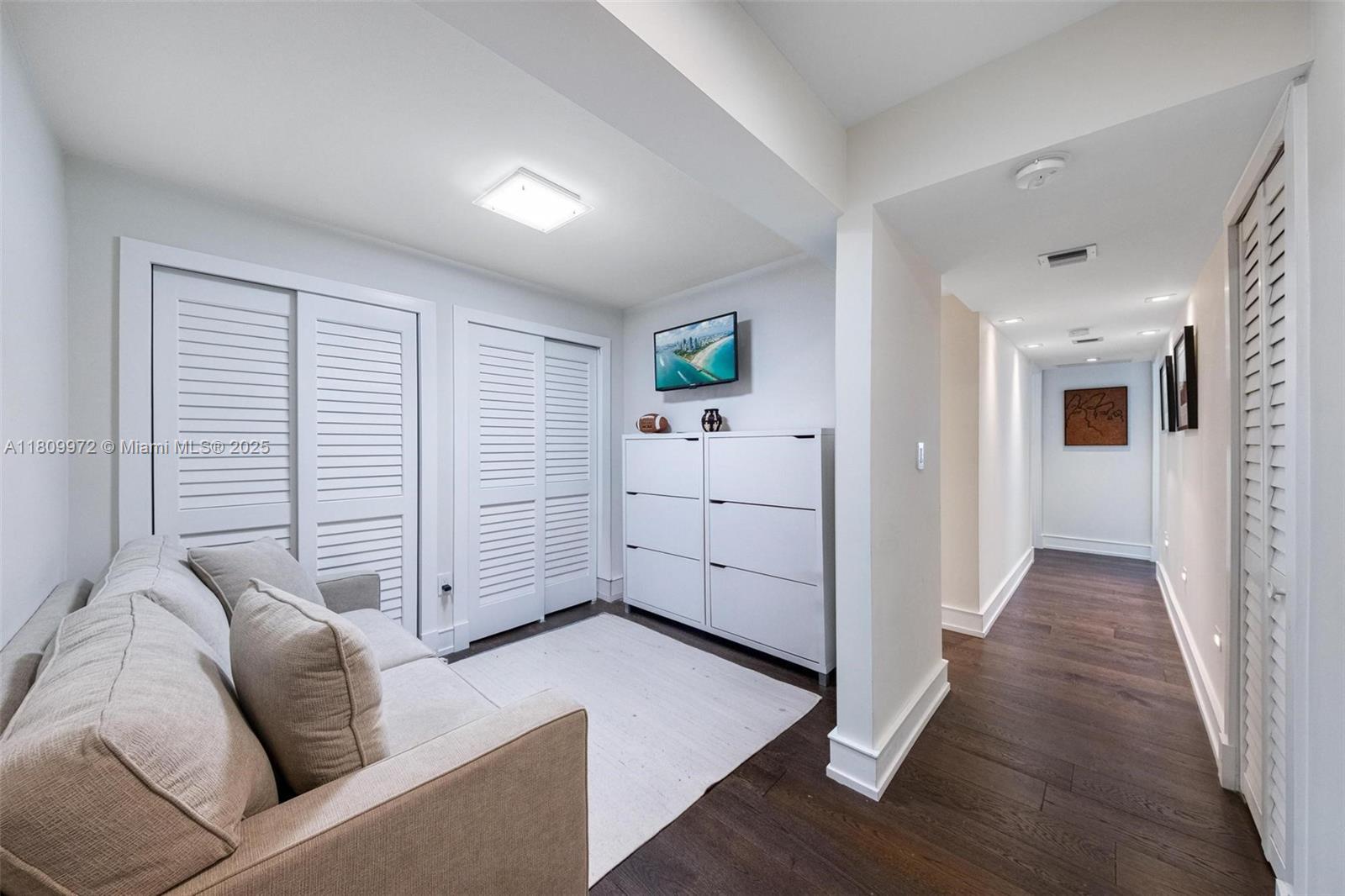 2901 South Bayshore Drive, Unit 17G/H Miami, FL 33133 - Photo 38 of 81 a view of a livingroom with furniture and wooden floor
