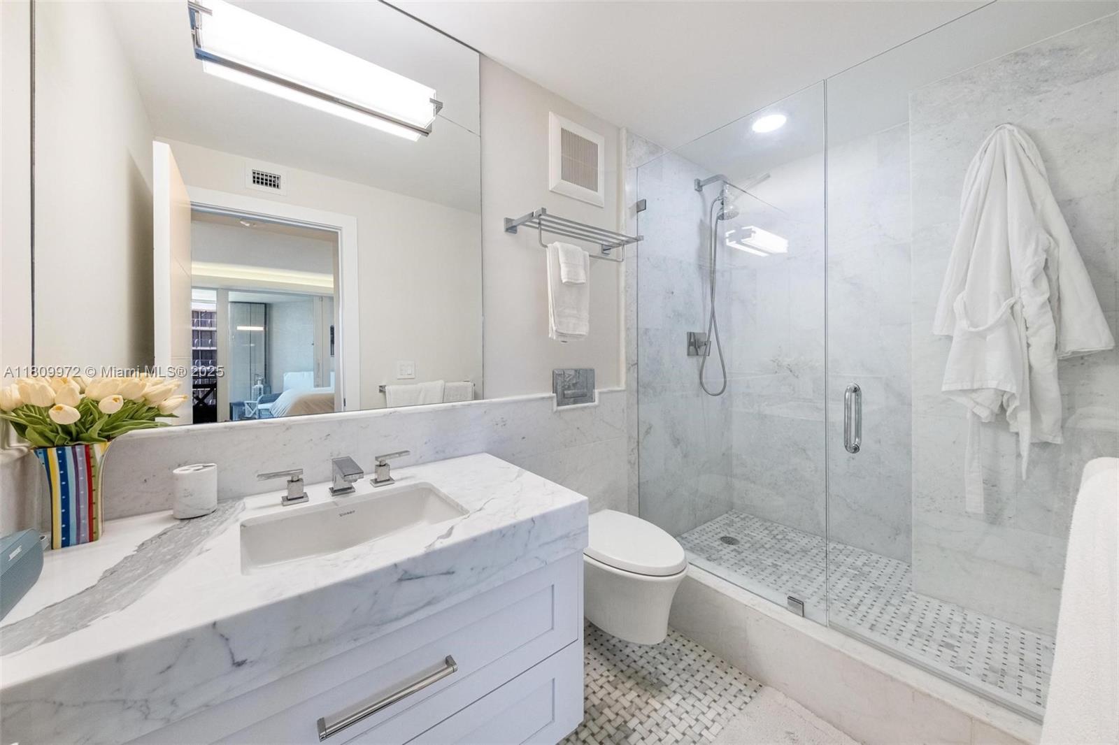 2901 South Bayshore Drive, Unit 17G/H Miami, FL 33133 - Photo 39 of 81 a bathroom with a sink a toilet and shower