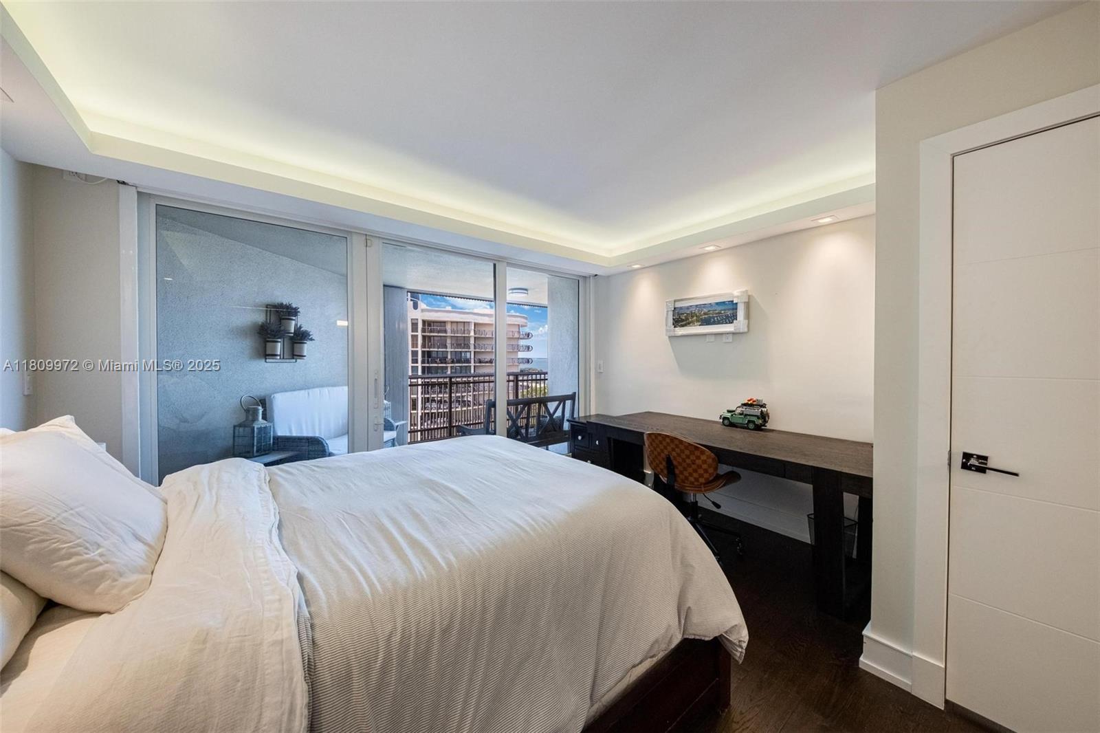 2901 South Bayshore Drive, Unit 17G/H Miami, FL 33133 - Photo 42 of 81 a bedroom with a bed and a window