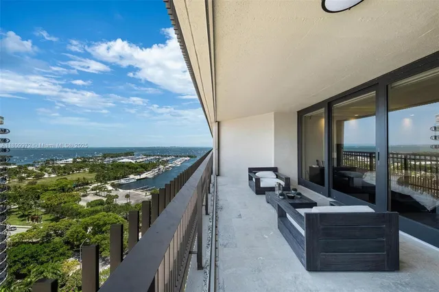 an aerial view of a house with swimming pool and patio