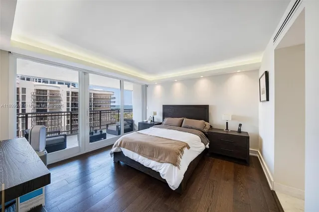 an aerial view of a house with a yard and lake view