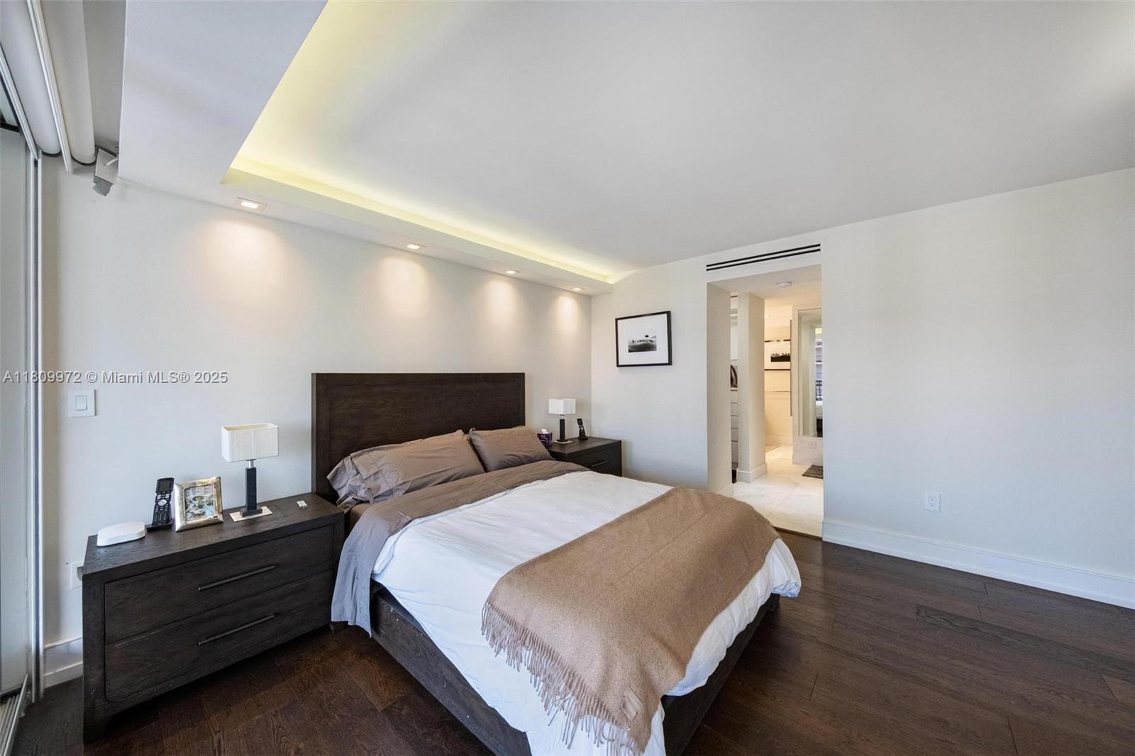 2901 South Bayshore Drive, Unit 17G/H Miami, FL 33133 - Photo 50 of 81 a bed room with a bed and a night stand