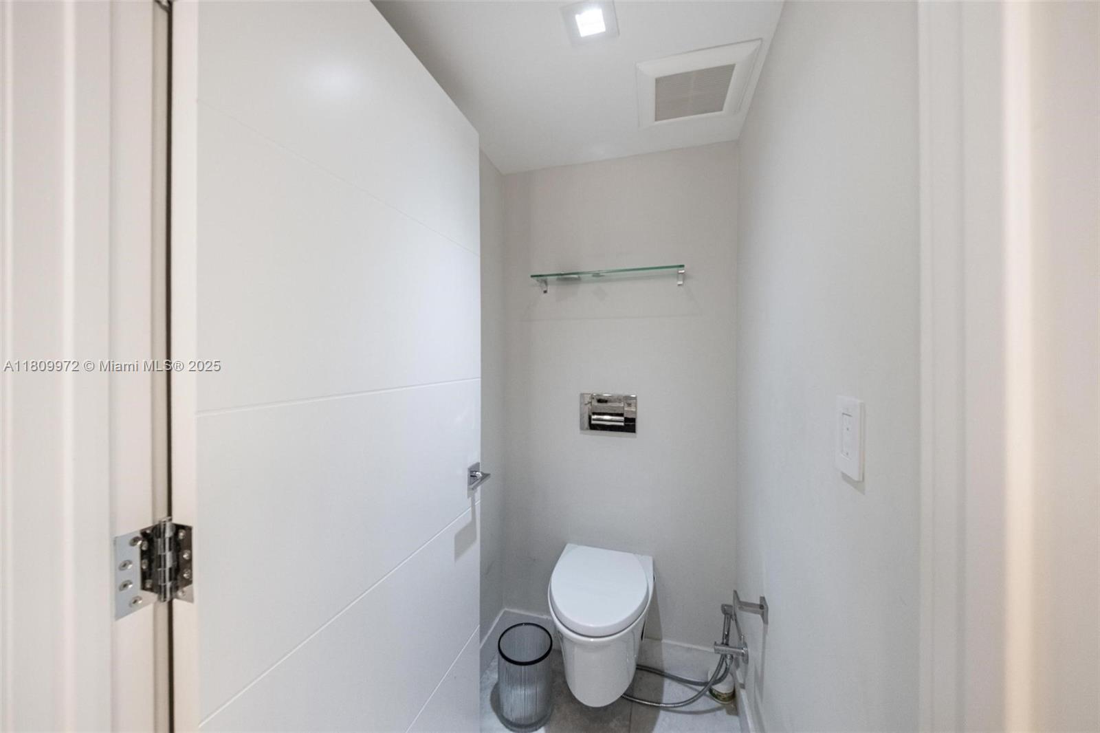 2901 South Bayshore Drive, Unit 17G/H Miami, FL 33133 - Photo 56 of 81 a white toilet sitting next to a shower
