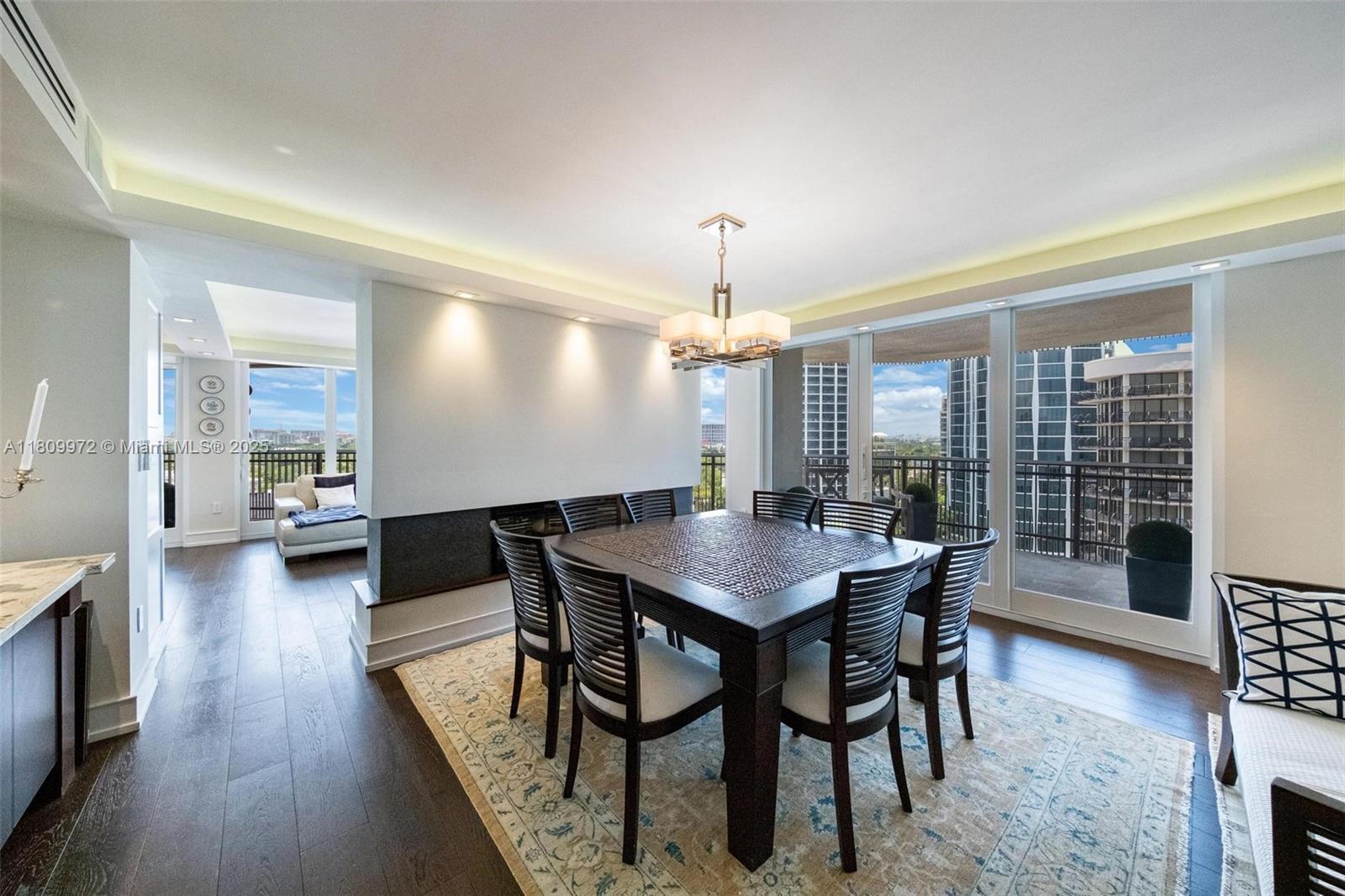 2901 South Bayshore Drive, Unit 17G/H Miami, FL 33133 - Photo 6 of 81 a view of a dining room with furniture window and wooden floor
