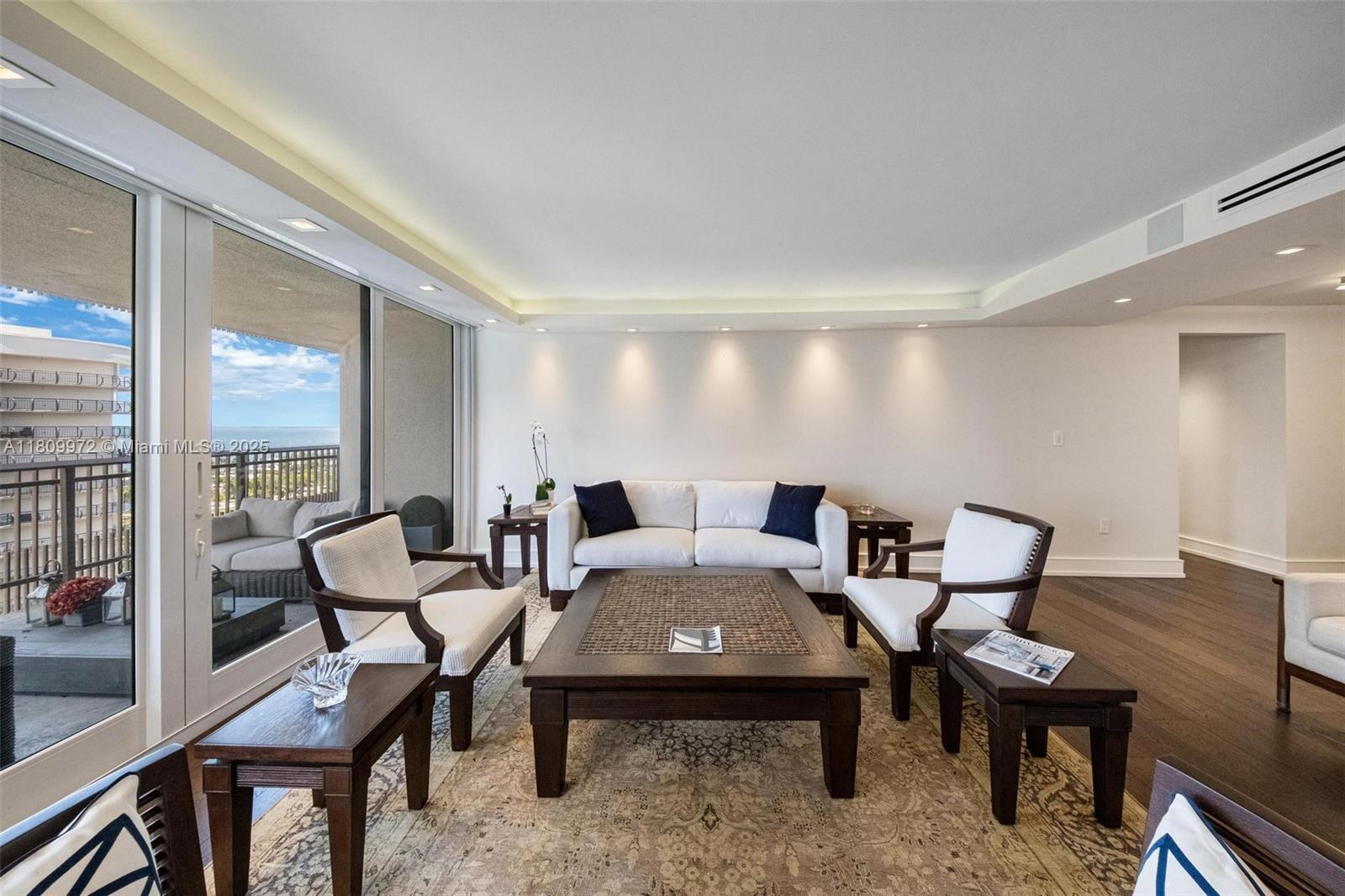2901 South Bayshore Drive, Unit 17G/H Miami, FL 33133 - Photo 7 of 81 a view of a dining room with furniture wooden floor and a potted plant