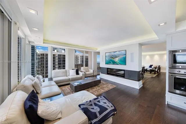 a large kitchen with a table and chairs in it