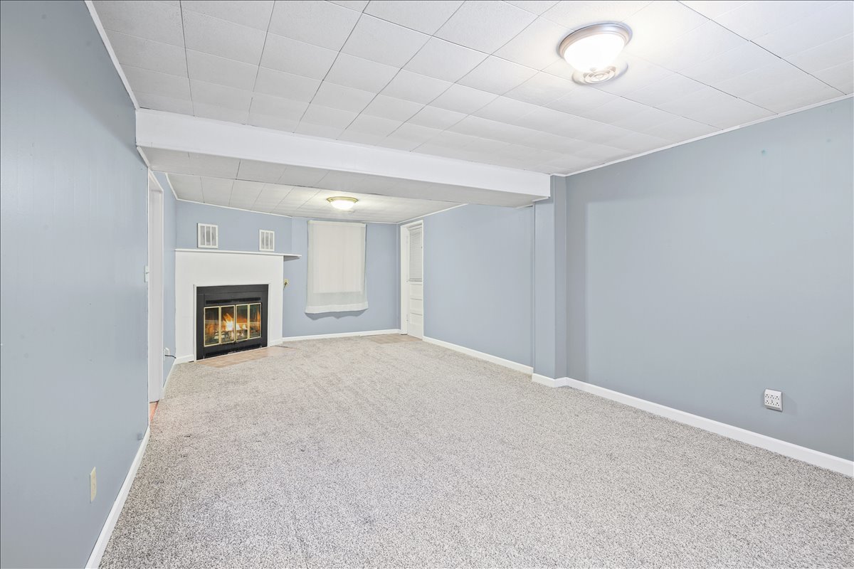 1513 Gates Drive Rantoul, IL 61866 - Photo 27 of 37 an empty room with fireplace