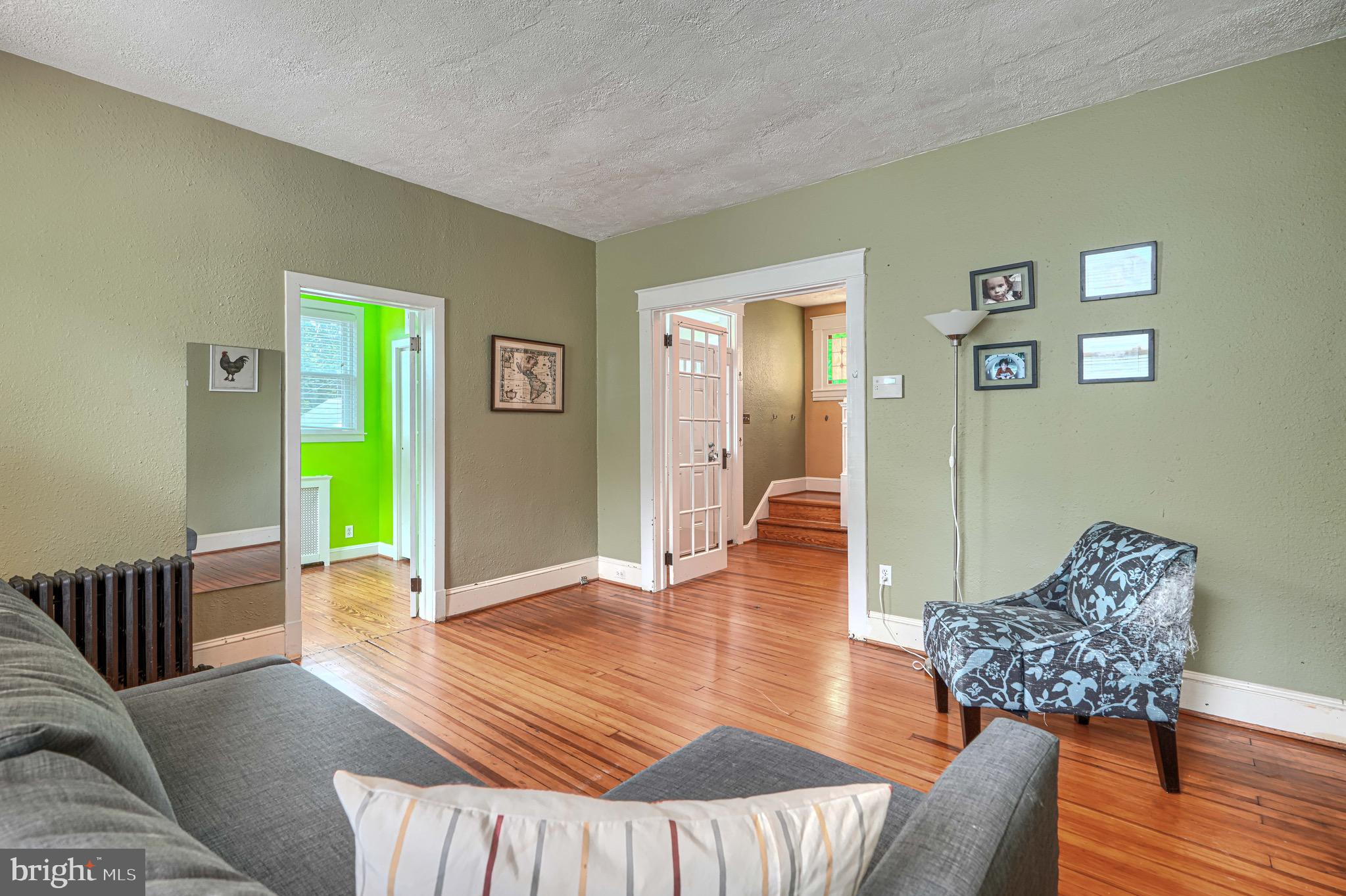 2705 Latona Road Baltimore, MD 21214 - Photo 27 of 53 a living room with furniture and wooden floor