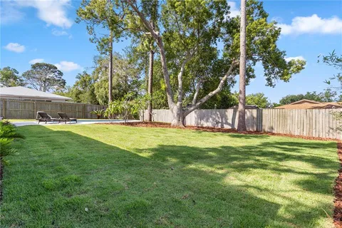 a view of a swimming pool with outdoor space and seating area