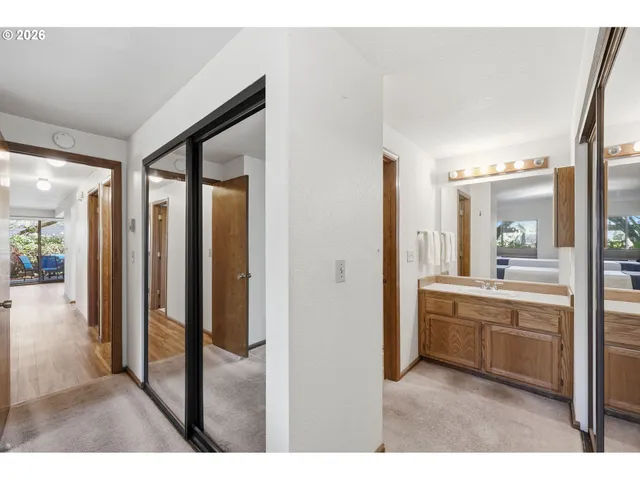 a open kitchen with a sink and refrigerator