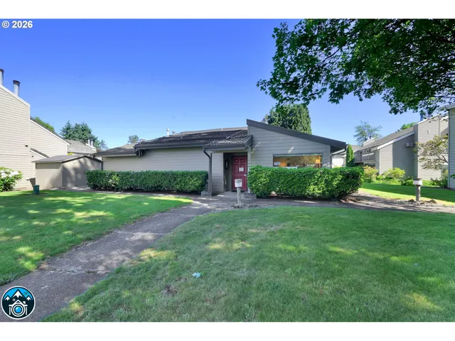 an aerial view of a house with swimming pool a yard and pool