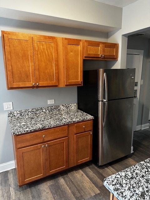 1614 North Harding Avenue, Unit G Chicago, IL 60647 - Photo 5 of 16 a kitchen with stainless steel appliances granite countertop a refrigerator and a sink