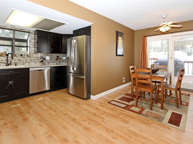 8819 Gardner Road Fox River Grove, IL 60021 - Photo 12 of 24 a living room with stainless steel appliances kitchen island granite countertop a sink and a stove top oven