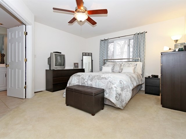 8819 Gardner Road Fox River Grove, IL 60021 - Photo 15 of 24 a bedroom with a bed dresser and a window