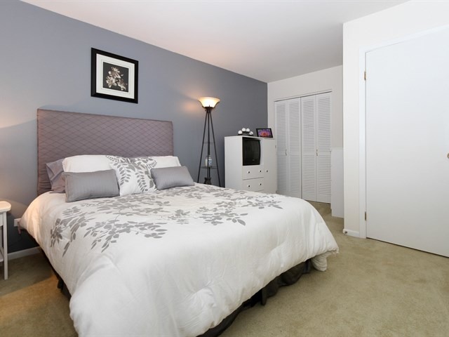 8819 Gardner Road Fox River Grove, IL 60021 - Photo 19 of 24 a large bed sitting in a bedroom and a table