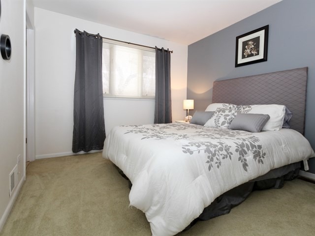 8819 Gardner Road Fox River Grove, IL 60021 - Photo 20 of 24 a bedroom with a bed and wall painting