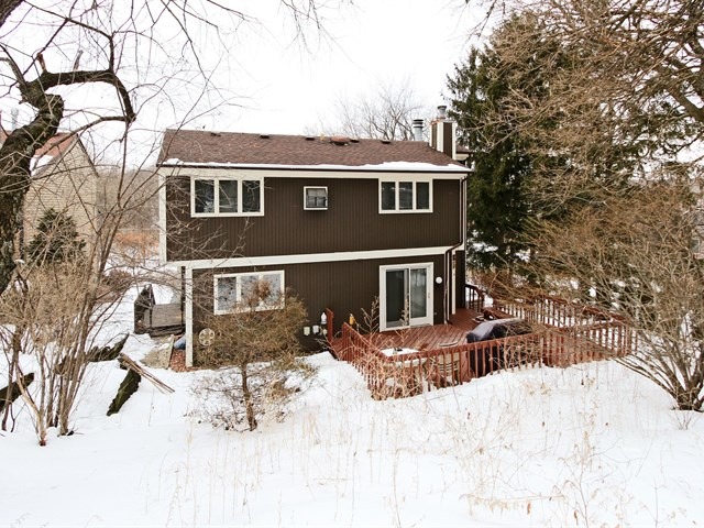 8819 Gardner Road Fox River Grove, IL 60021 - Photo 23 of 24 a front view of a house with a yard covered in snow